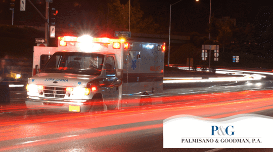 Ambulance in street with lights on