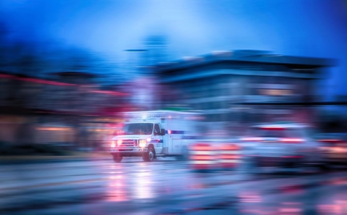 Ambulance speeding through city