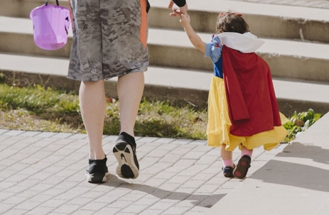 Parent and child trick-or-treating