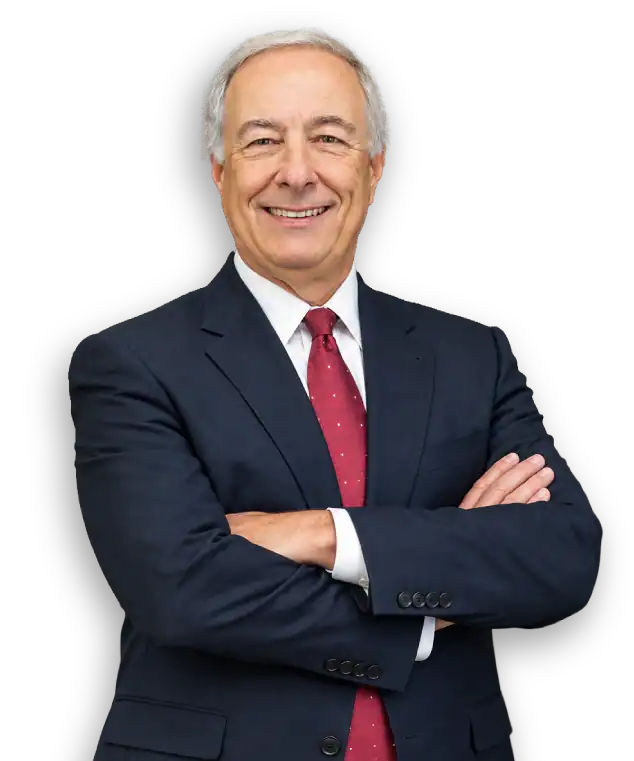 Professional headshot of a senior attorney in a navy suit and red tie, cross-armed, representing Pal.